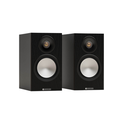 Salon 1 Audio pair of black Monitor Audio Bronze 50 7G bookshelf speakers with gold dome tweeters and silver drivers.