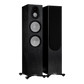 Salon 1 Audio Monitor Audio Silver 500 7G black floorstanding speakers with exposed drivers and one with grille on.
