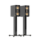 Salon 1 Audio Monitor Audio Studio 89 high-gloss black bookshelf speakers with gold drivers on matching speaker stands