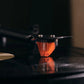 Salon 1 Audio Ortofon 2M Bronze moving magnet cartridge playing a vinyl record with a bronze-tinted body