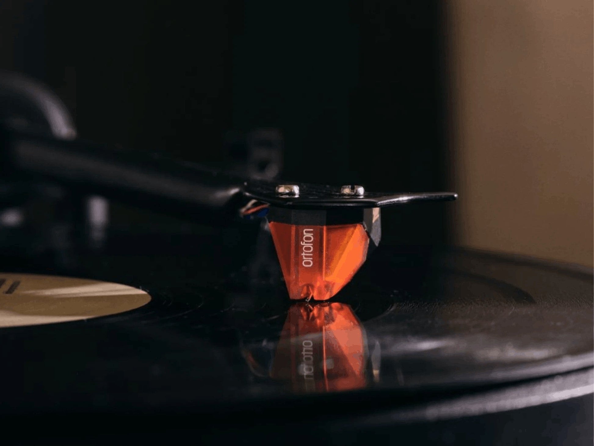 Salon 1 Audio Ortofon 2M Bronze moving magnet cartridge playing a vinyl record with a bronze-tinted body