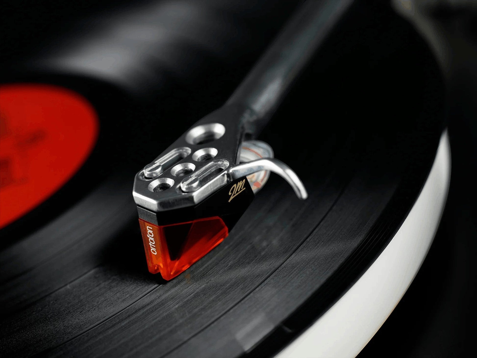 Salon 1 Audio Ortofon 2M Bronze moving magnet phono cartridge with bronze and black finish on a vinyl record
