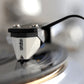 Salon 1 Audio Ortofon 2M Mono moving magnet cartridge with white and black body tracking on a vinyl record