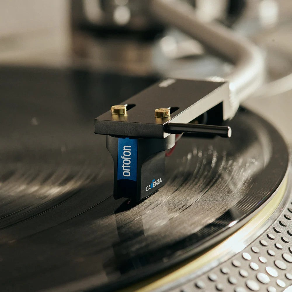 Salon 1 Audio Ortofon MC Cadenza Blue moving coil phono cartridge playing a black vinyl record on a turntable.