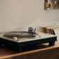 Salon 1 Audio Ortofon MC Quintet Blue moving coil cartridge installed on a silver turntable playing a vinyl record