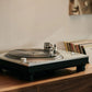 Salon 1 Audio Ortofon MC Quintet Mono cartridge mounted on a turntable playing a vinyl record in a home setting.