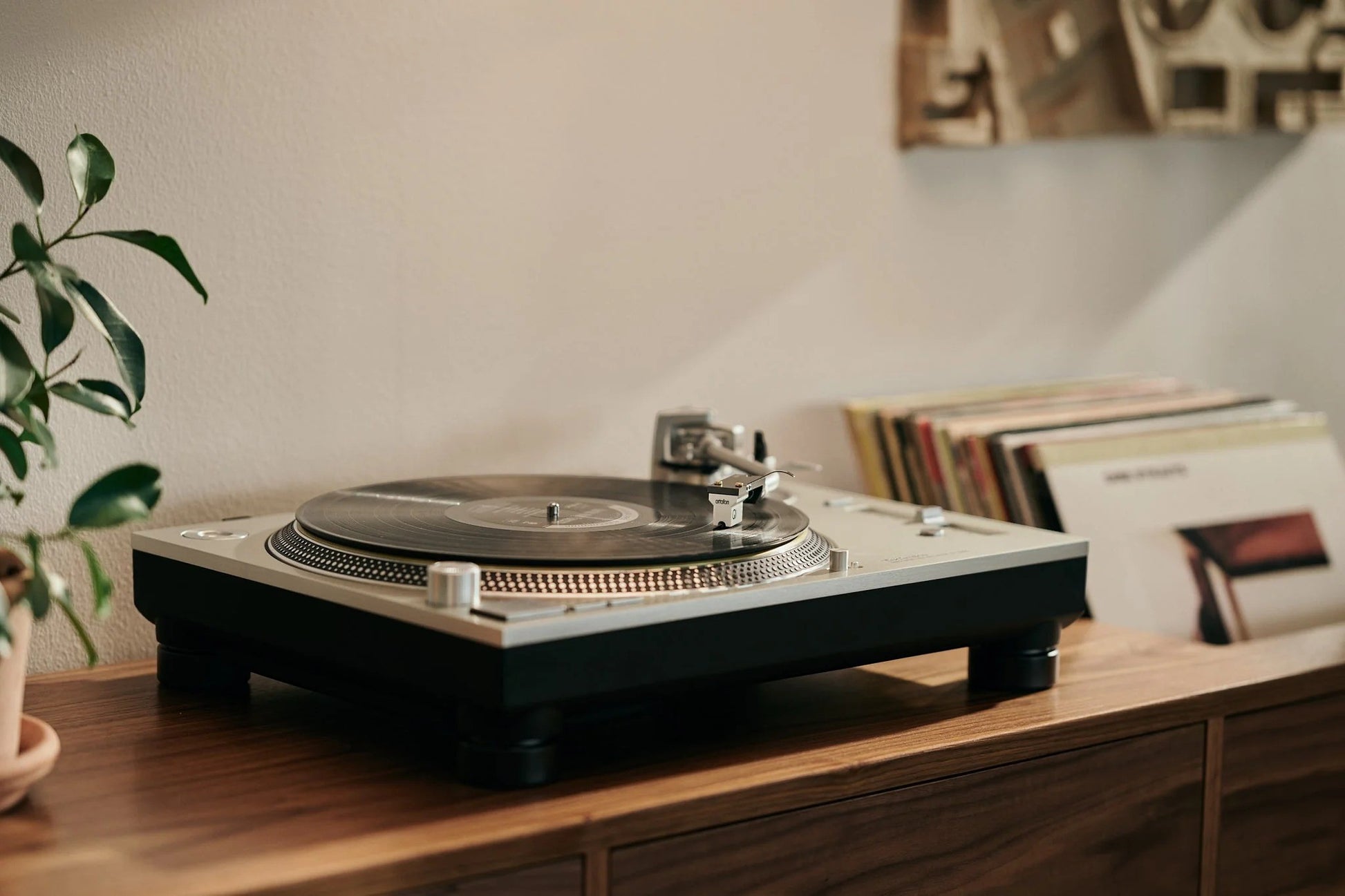 Salon 1 Audio Ortofon MC Quintet Mono cartridge mounted on a turntable playing a vinyl record in a home setting.