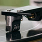Salon 1 Audio Ortofon MC Windfeld Ti moving coil phono cartridge in silver and black mounted on a vinyl record player