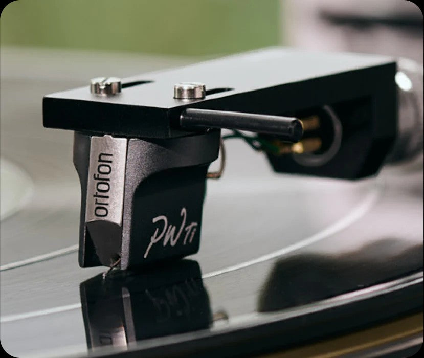 Salon 1 Audio Ortofon MC Windfeld Ti moving coil phono cartridge in silver and black mounted on a vinyl record player