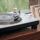 Salon 1 Audio Ortofon MC A Mono phono cartridge mounted on a silver turntable playing a vinyl record