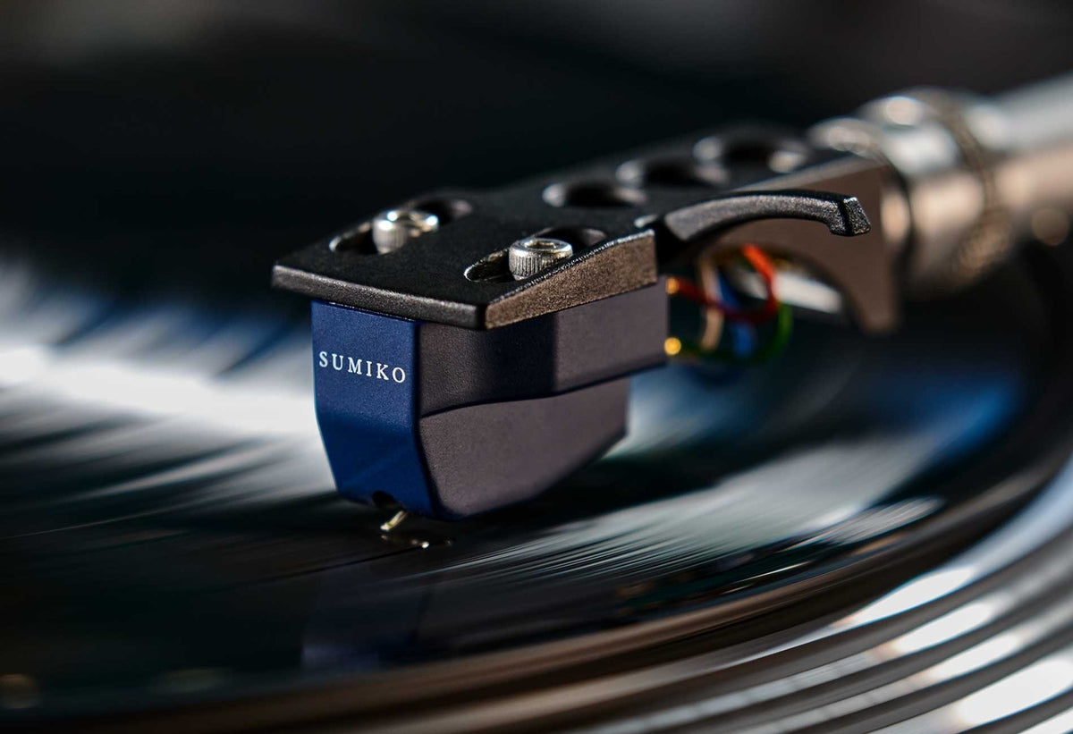 Salon 1 Audio Sumiko Blue Point No. 3 High output moving coil cartridge tracking on a black vinyl record.