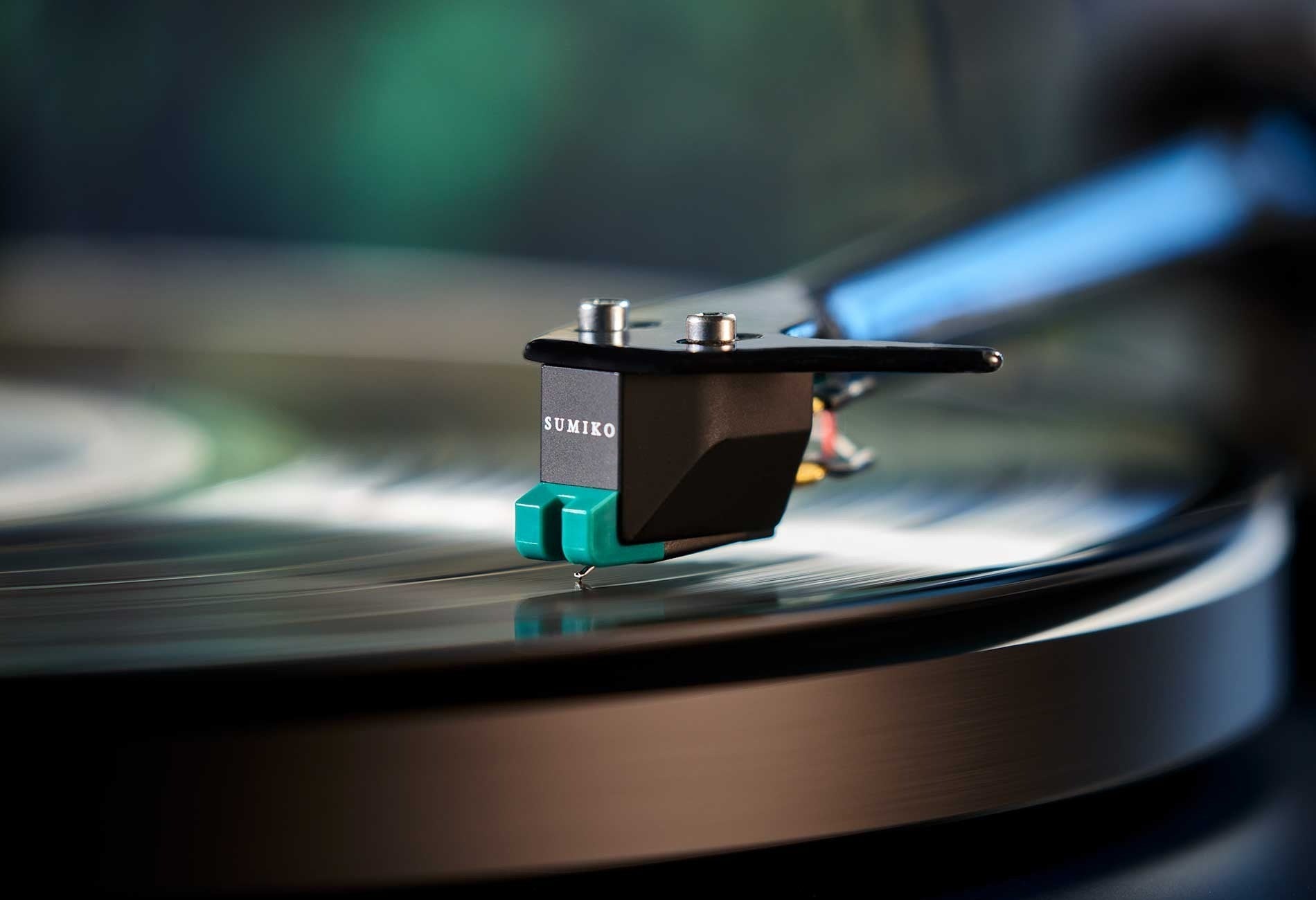 Salon 1 Audio Sumiko Olympia moving magnet phono cartridge with teal stylus tracking on a vinyl record