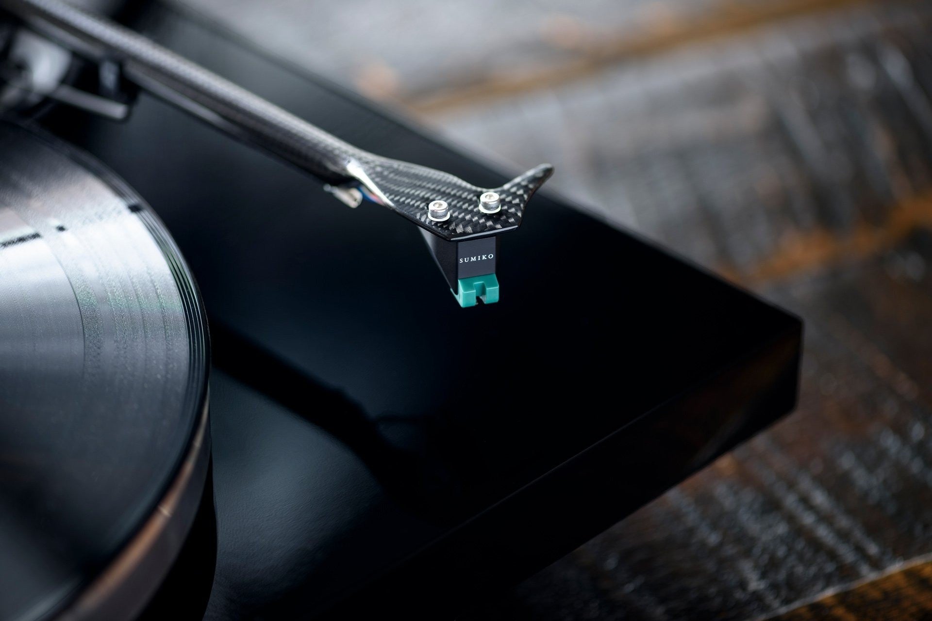 Salon 1 Audio Sumiko Olympia moving magnet phono cartridge with teal stylus mounted on a carbon fiber tonearm