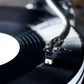 Salon 1 Audio Sumiko Rainier moving magnet cartridge mounted on a carbon fiber tonearm playing a black vinyl record