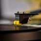 Salon 1 Audio Sumiko RS 78 replacement stylus with yellow housing on a black cartridge playing a vinyl record