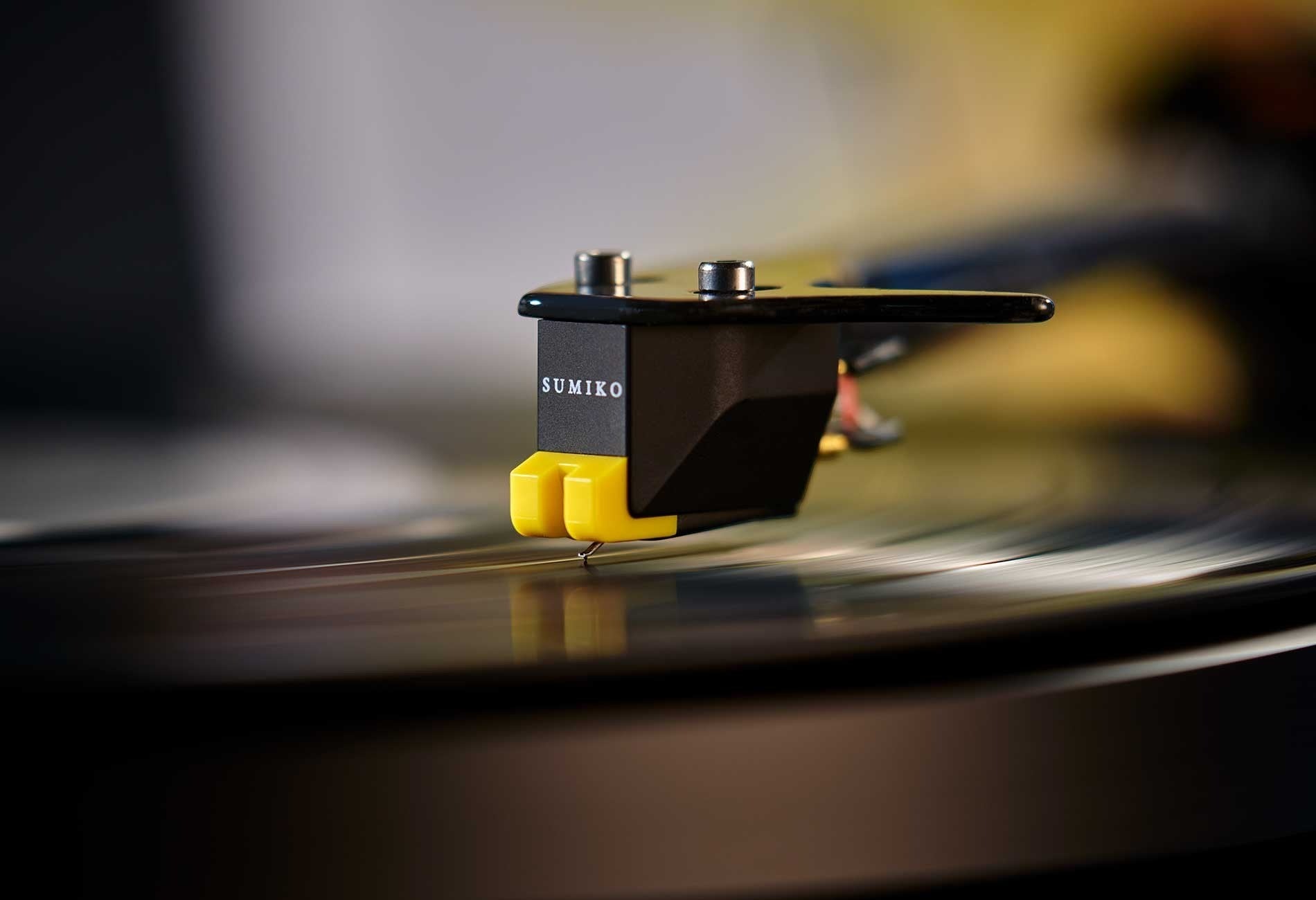 Salon 1 Audio Sumiko RS 78 replacement stylus with yellow housing on a black cartridge playing a vinyl record