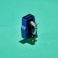 Salon 1 Audio Sumiko Songbird High output moving coil cartridge with a blue open-body design on a green background.