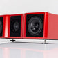Salon 1 Audio Wilson Audio WASAE center channel speaker in a glossy red finish with adjustable spikes on white surface