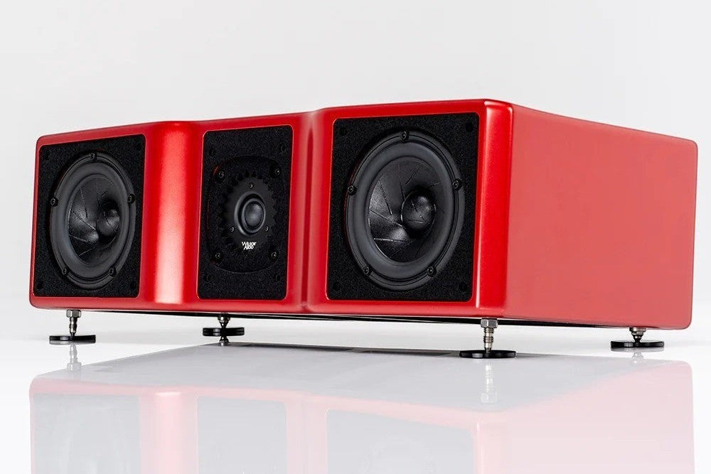 Salon 1 Audio Wilson Audio WASAE center channel speaker in a glossy red finish with adjustable spikes on white surface