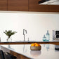 Salon 1 Audio Wilson Audio TuneTot bookshelf speakers in a modern kitchen setting on a white countertop.
